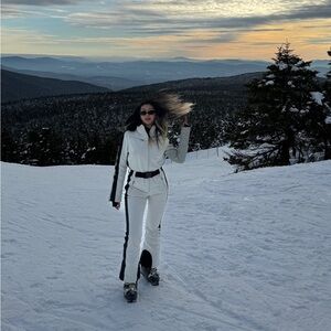 White ski suit with removable fur trim hood
